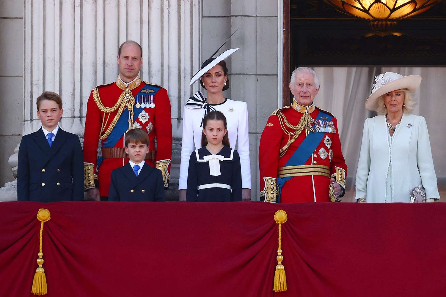 Prince George of Wales, Britain's Prince William, Prince of Wales, Britain's Prince Louis of Wales, Britain's Catherine, Princess of Wales, Britain's Princess Charlotte of Wales, Britain's King Charles III and Britain's Queen Camilla stand on the balcony of Buckingham Palace after attending the King's Birthday Parade "Trooping the Colour" in London 