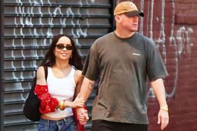 Zoe Kravitz and Channing Tatum hold hands on a stroll in New York City. Zoe wore a white cropped tank top, jeans, and sandals. Channing sported a baseball cap, t-shirt, dark trousers, and white trainers.