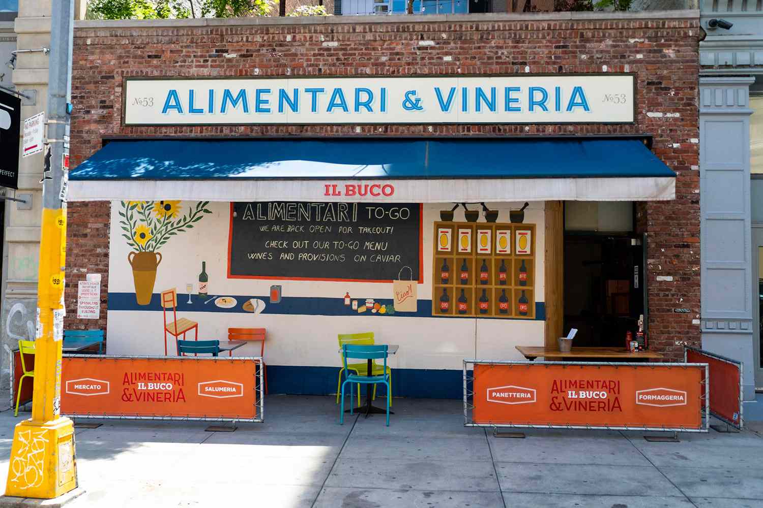 A view of the art on the facade of Il Buco Alimentari & Vineria 