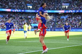 Mallory Swanson of Team United States celebrates with Lindsey Horan, right, after scoring their side's first goal during the women's gold medal match between Team Brazil and Team United States at Parc des Princes during the 2024 Paris Summer Olympic Games in Paris, France. 