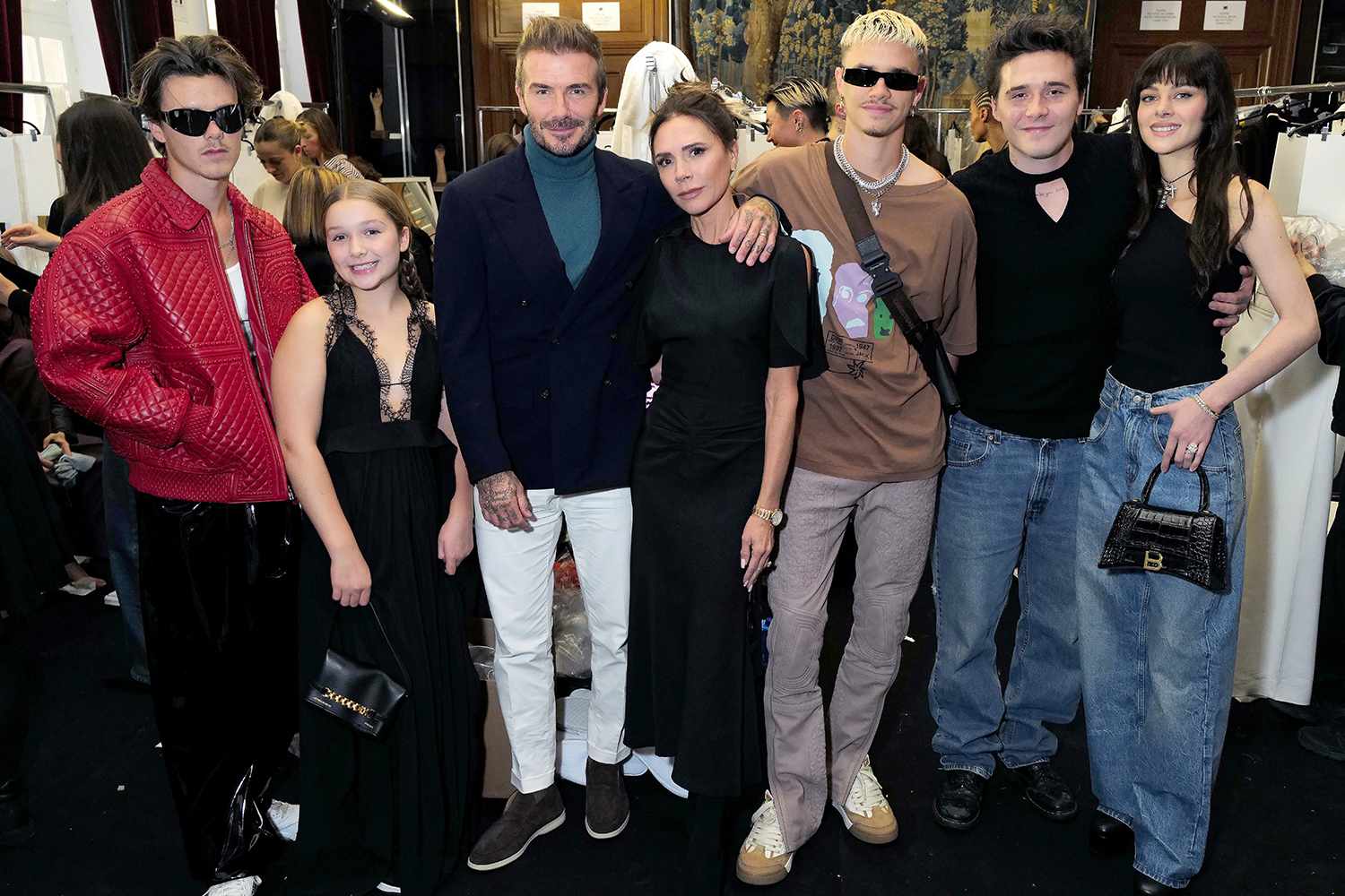 Cruz Beckham, Harper Beckham, David Beckham, Victoria Beckham, Romeo Beckham, Brooklyn Beckham and Nicola Peltz Beckham attends the Victoria Beckham Spring/summer 2023 Runway show