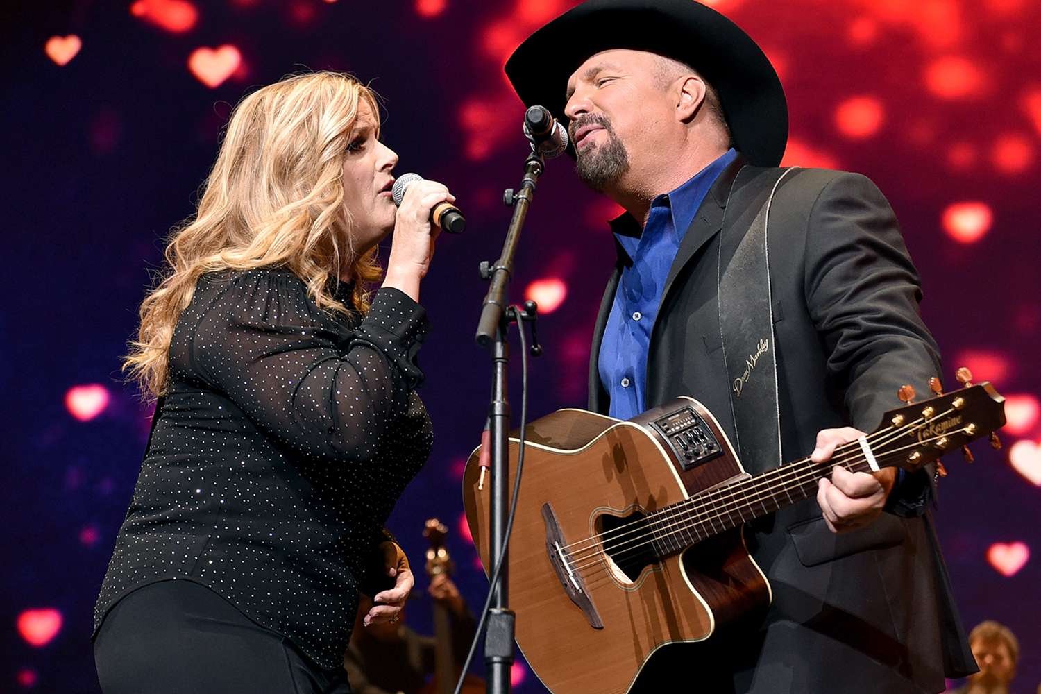 Trisha Yearwood and Garth Brooks perform onstage for Loretta Lynn: An All-Star Birthday Celebration Concert at Bridgestone Arena on April 1, 2019 in Nashville, Tennessee. 