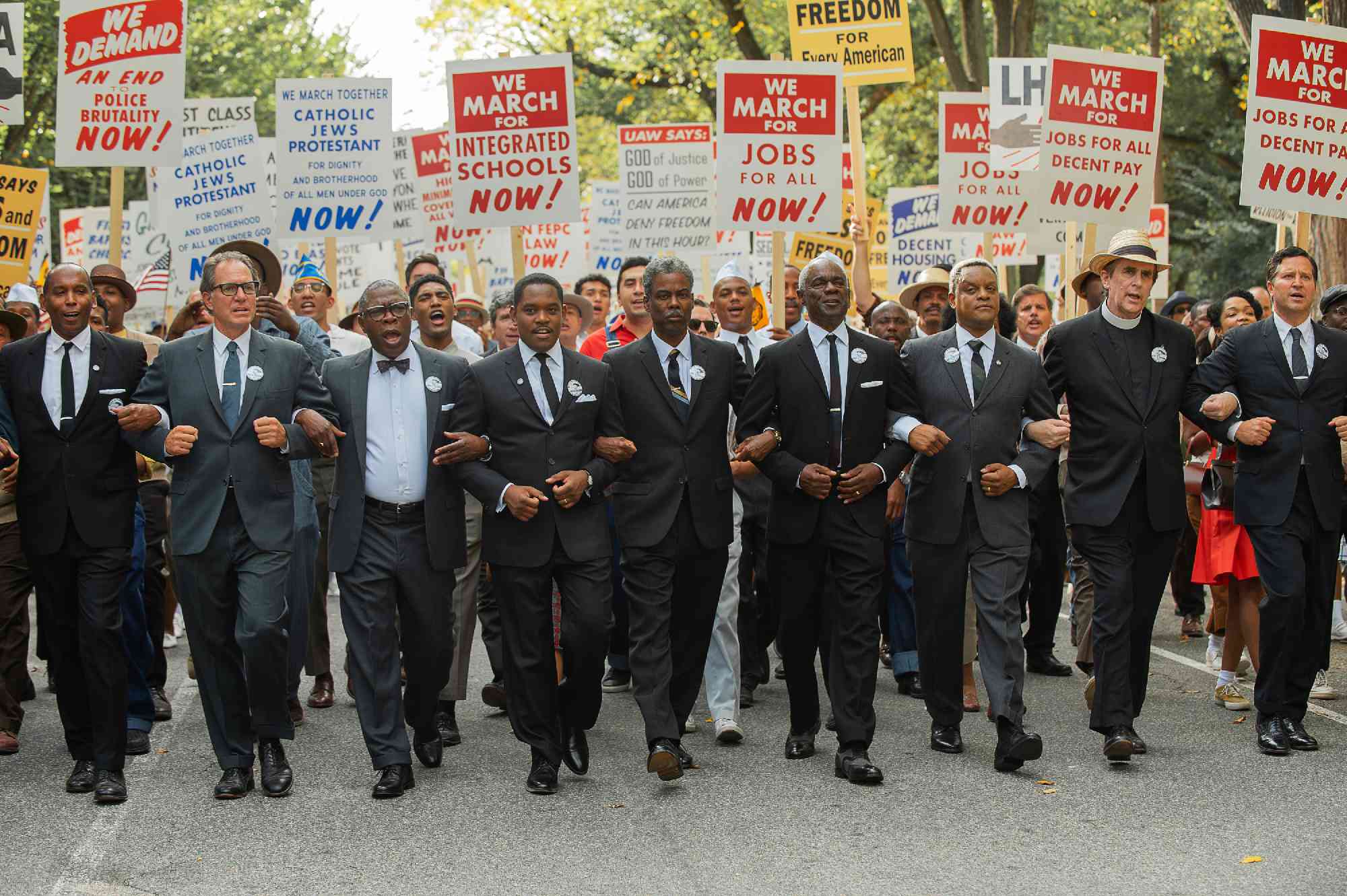 Rustin. Michael Potts as Cleve Robinson, Aml Ameen as Martin Luther King, Chris Rock as NAACP Exec. Dir. Roy Wilkins and Glynn Turman as A Philip Randolph in Rustin.