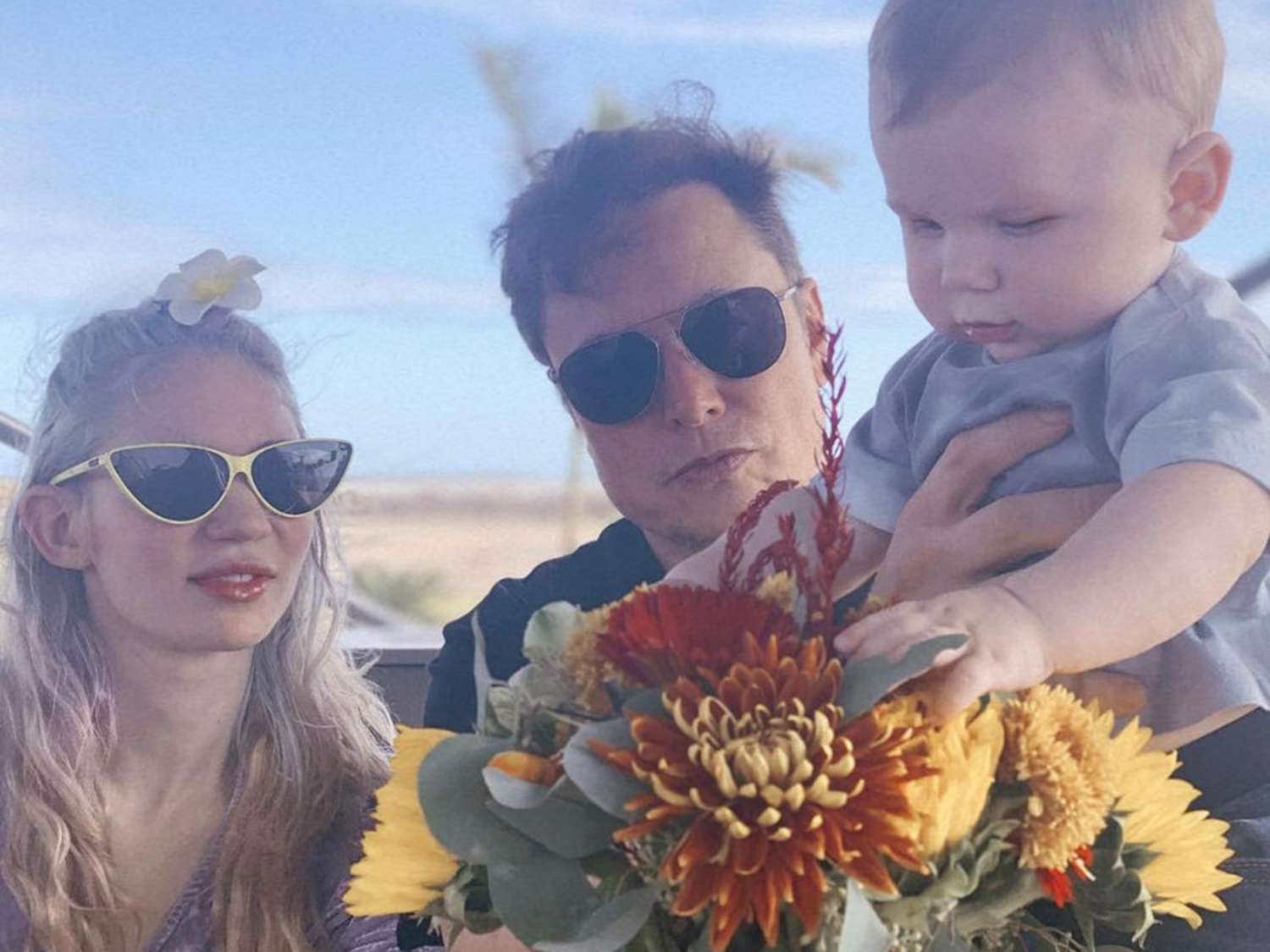 Grimes and Elon Musk with their son X