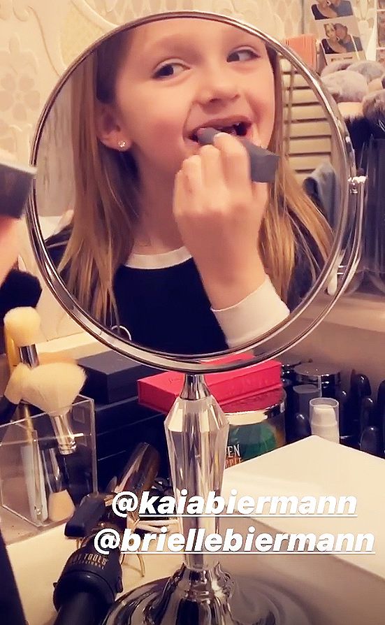 Kaia Biermann applying lipstick like her big sister Brielle