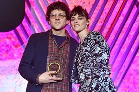 Jesse Eisenberg (L) and Kristen Stewart