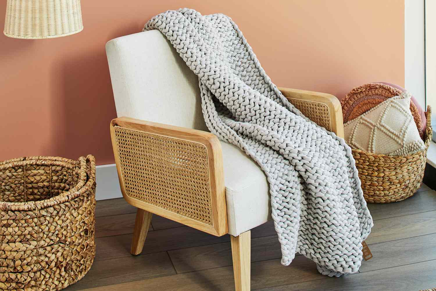 Bearaby Cotton Napper on white chair in a living room setting