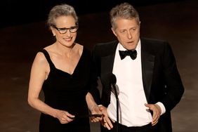 Andie MacDowell and Hugh Grant speaks onstage during the 95th Annual Academy Awards at Dolby Theatre on March 12, 2023 in Hollywood, California.