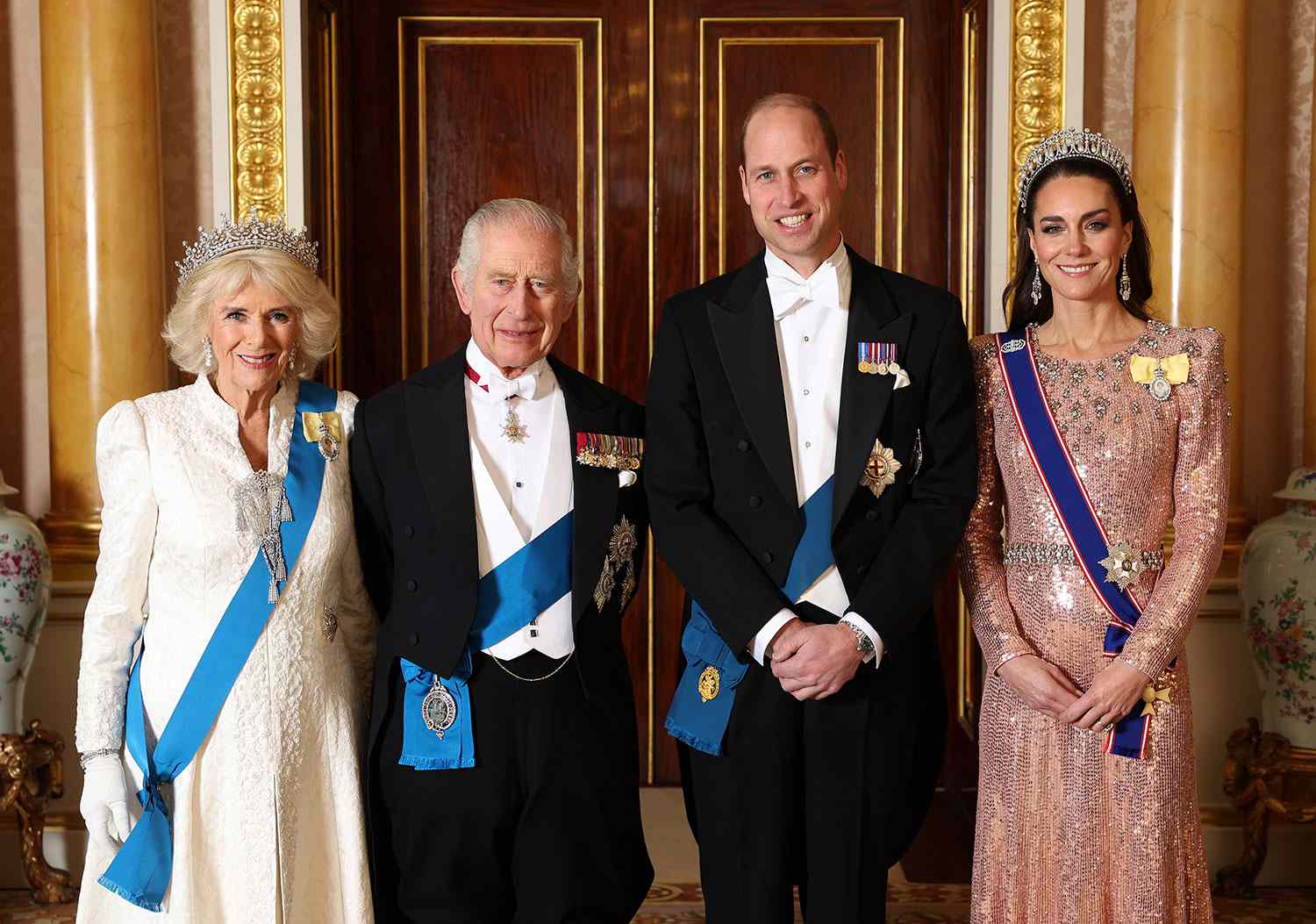 LONDON, ENGLAND - DECEMBER 05: (EDITORIAL USE ONLY) (L-R) Queen Camilla, King Charles III, Prince William, Prince of Wales and Catherine, Princess of Wales pose for a photograph ahead of The Diplomatic Reception in the 1844 Room at Buckingham Palace on December 05, 2023 in London, England. 