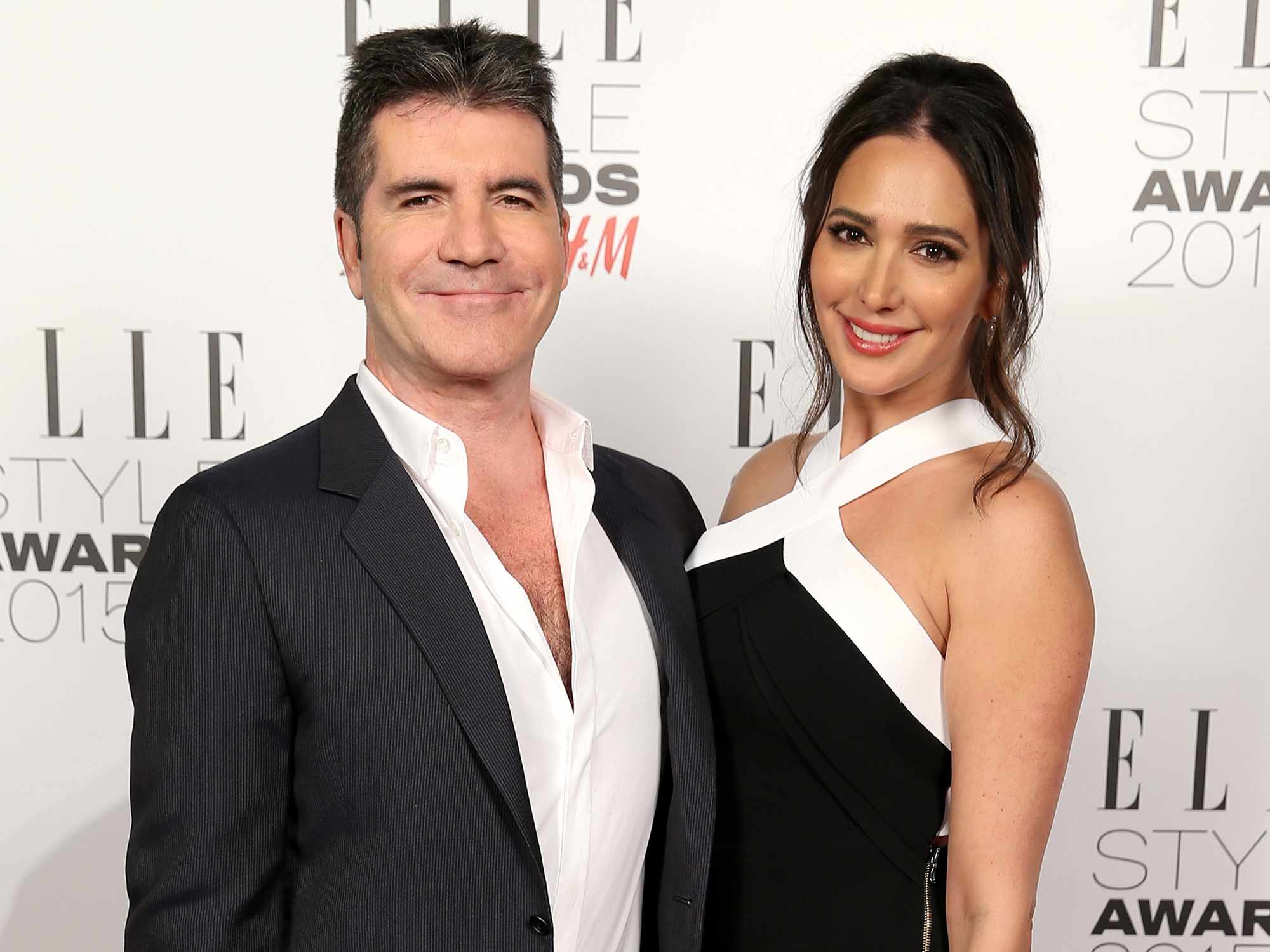 Lauren Silverman (R) poses with Simon Cowell, winner of the Outstanding Contribution to Entertainment Award, in the winners room during the Elle Style Awards 2015 at Sky Garden @ The Walkie Talkie Tower on February 24, 2015 in London, England