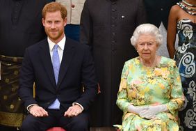 Meghan, Duchess of Sussex, Prince Harry, Duke of Sussex and Queen Elizabeth II at the Queen's Young Leaders Awards Ceremony at Buckingham Palace on June 26, 2018 in London