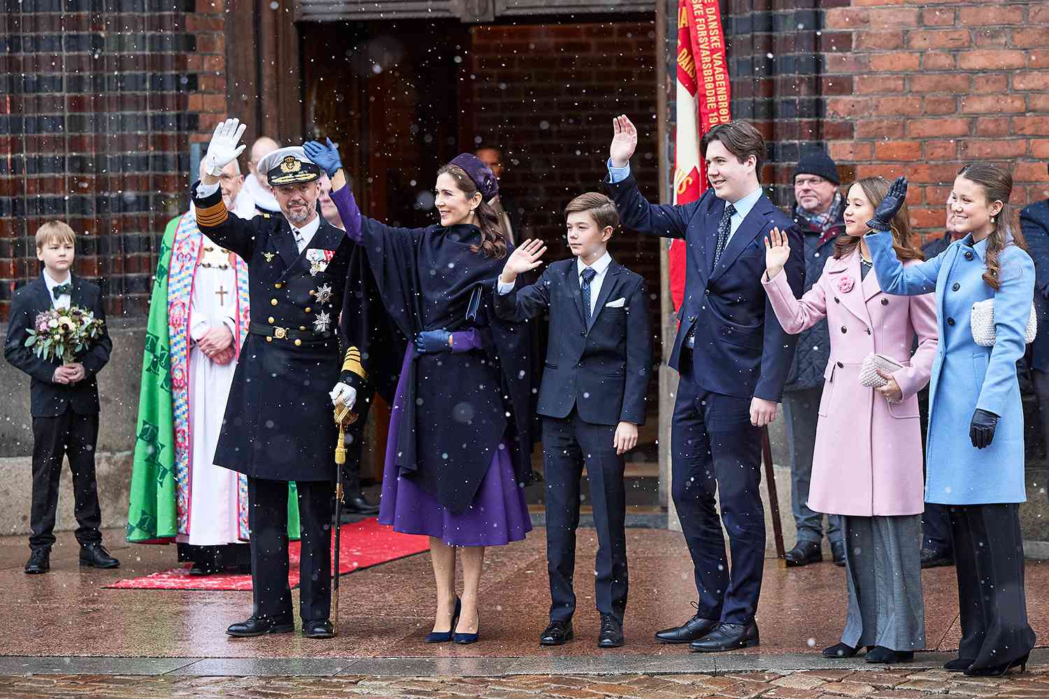 King Frederik X, Queen Mary, Prince Vincent, Crown Prince Christian, Princess Isabella and Princess Josephine greet the crowd after a church service on the occasion of the change of throne in Denmark, in Aarhus Cathedral, on January 21, 2024.