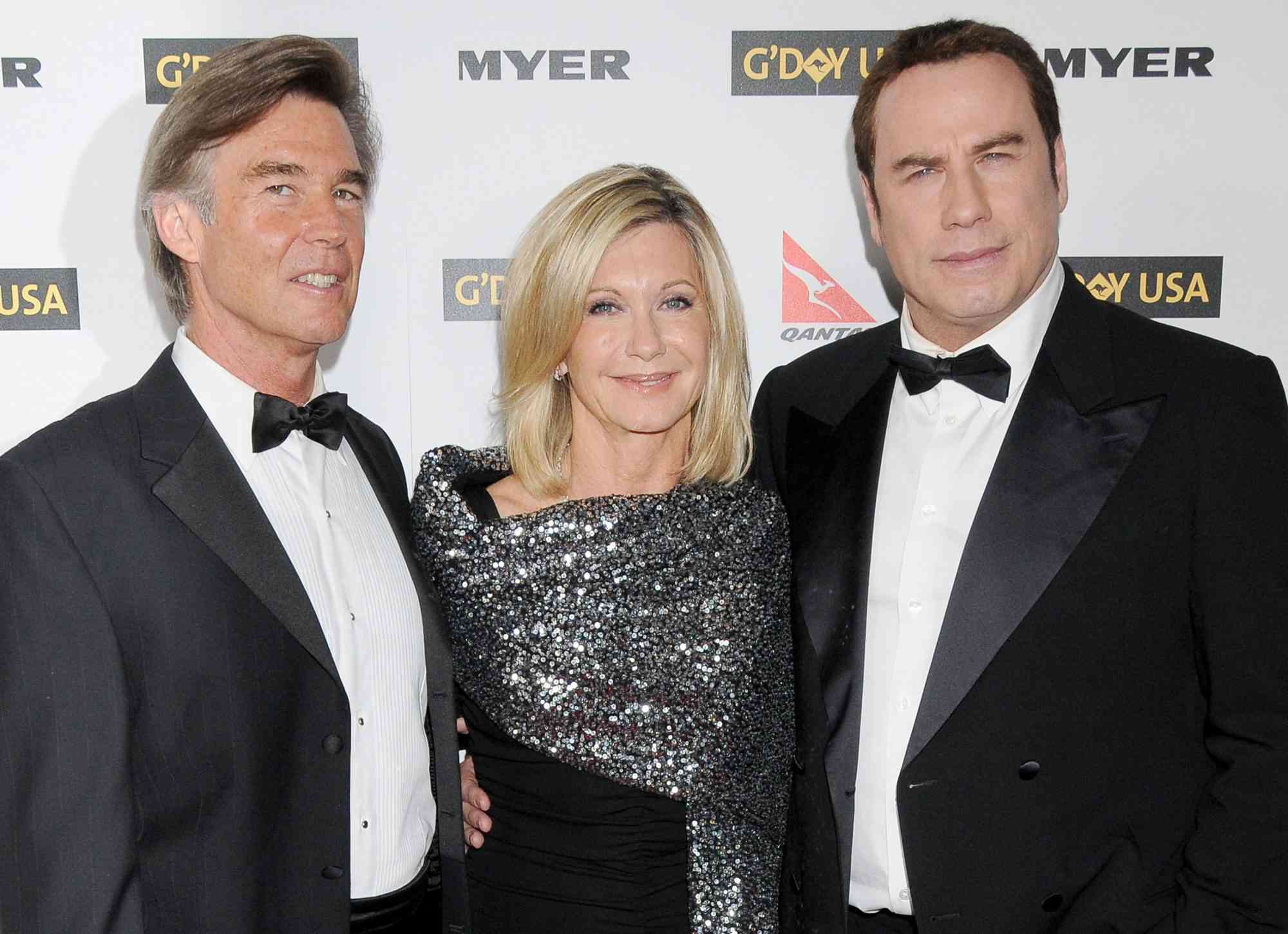 HOLLYWOOD, CA - JANUARY 16: Amazon John Easterling, Olivia Newton-John and John Travolta arrive at G'Day USA 2010 Los Angeles Black Tie Gala held at Hollywood & Highland on January 16, 2010 in Hollywood, California. (Photo by Gregg DeGuire/FilmMagic)