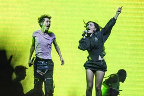 Charli XCX joins Troye Sivan on stage during the Something to Give Each Other Tour at OVO Arena Wembley on June 27, 2024 in London, England.