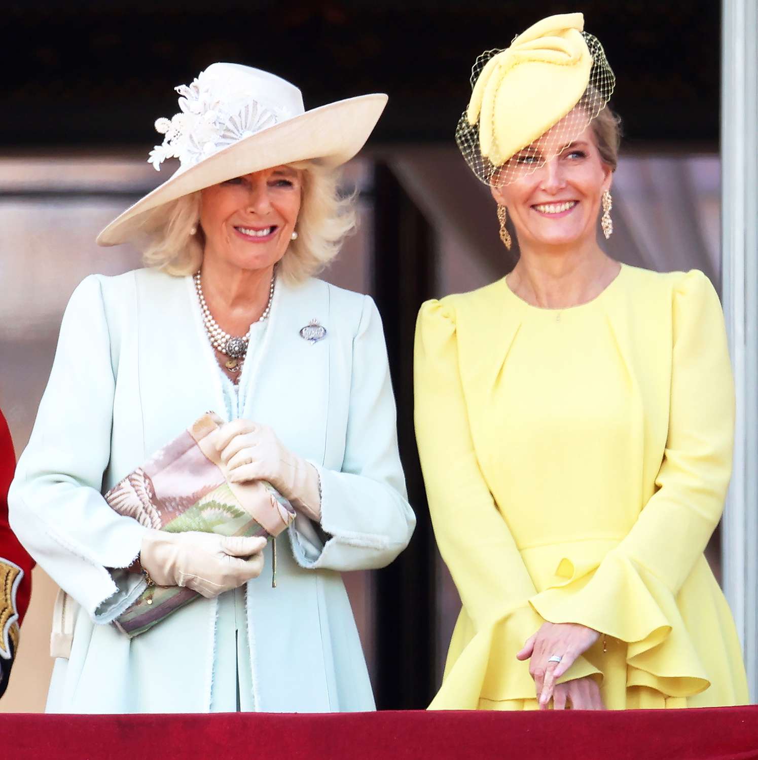 Queen Camilla and Sophie, Duchess of Edinburgh laugh as they stand on the balcony during Trooping the Colour at Buckingham Palace on June 15, 2024 in London, England.