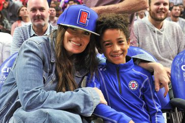 Idina Menzel and Walker Nathaniel Diggs attend a basketball game between the Los Angeles Clippers and the Charlotte Hornets at Staples Center on October 28, 2019 in Los Angeles, California.