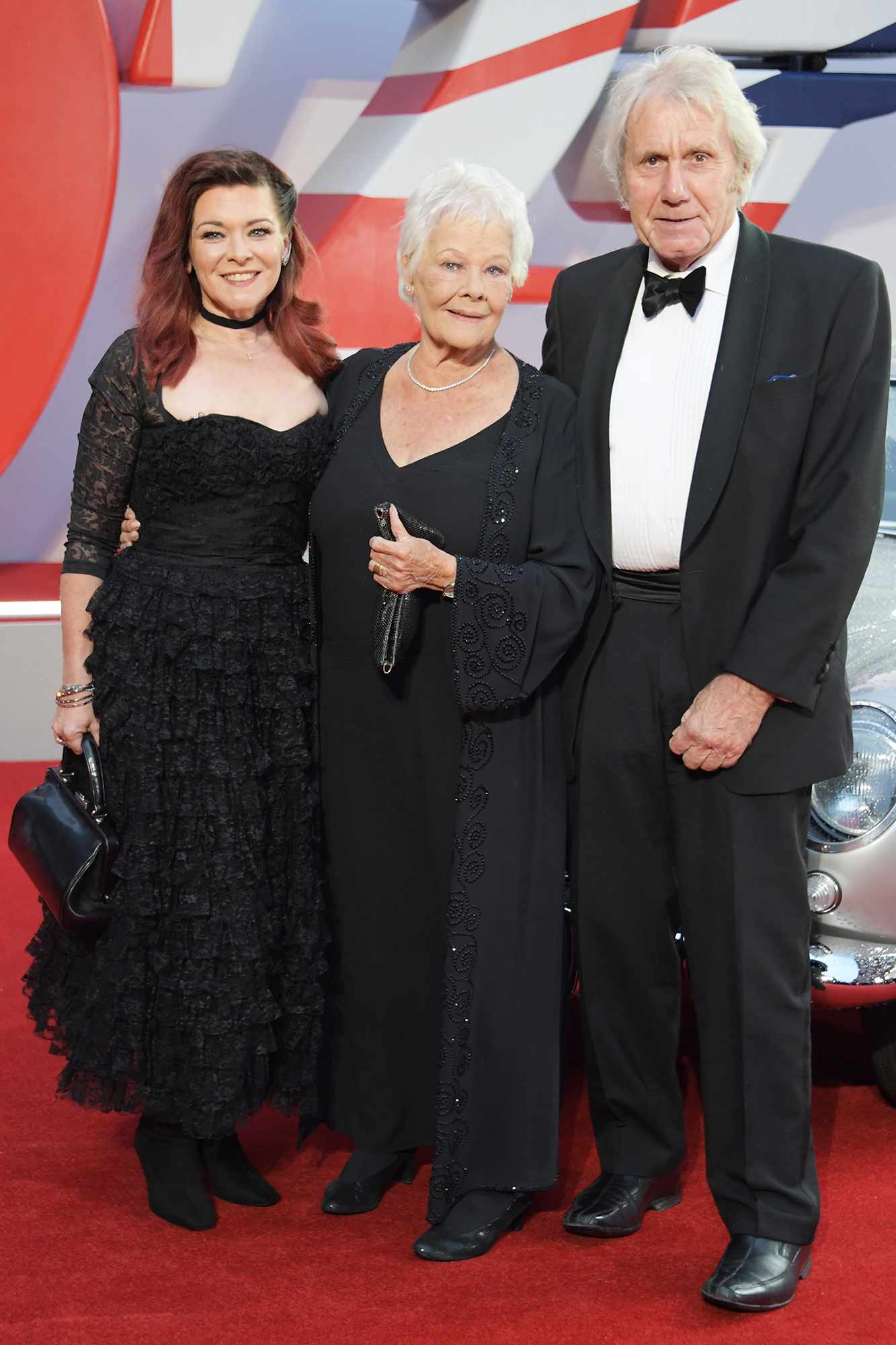 Finty Williams, Dame Judi Dench and David Mills attend the World Premiere of "No Time To Die" at the Royal Albert Hall on September 28, 2021 in London