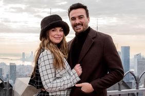 Hannah Brown and Adam Woolard visit 'Top of The Rock' at Rockefeller Center on December 10, 2021 in New York City