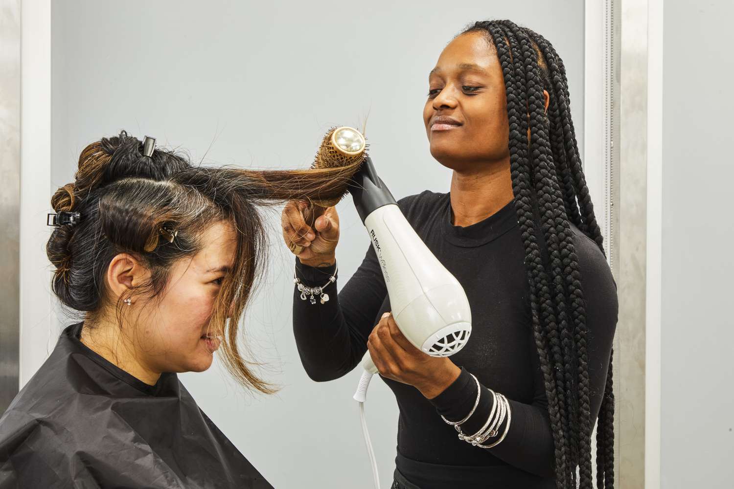 Person blowdrying another person's hair with Rusk W8less Professional 2000 Watt Dryer