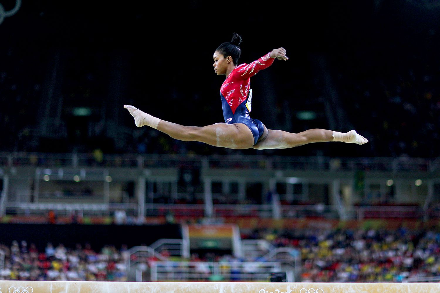 Gabrielle Douglas #392 of the United States performing her routine on the Balance Beam during the Artistic Gymnastics Women's Team Qualification round at the Rio Olympic Arena on August 7, 2016 in Rio de Janeiro, Brazil.