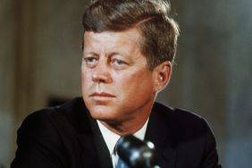 President John F. Kennedy at his desk in the White House on his first day in office as President of the United States.