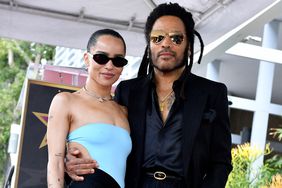 US musician Lenny Kravitz poses with his daughter actress Zoe Kravitz on his newly unveiled star during his Walk of Fame ceremony in Los Angeles, California, on March 12, 2024. 