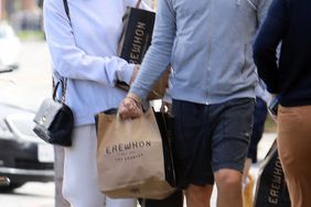 Leonardo DiCaprio and Camila Morrone step out for some grocery shopping in Los Angeles wearing matching slides. DiCaprio, 45, kept a low profile in a baseball cap, grey hoodie, and Alo shorts.