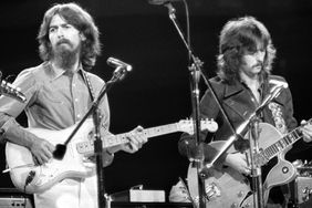 George Harrison and Eric Clapton performing at the Concert for Bangladesh at Madison Square Garden.