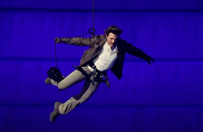 US' actor Tom Cruise jumps from the roof of the Stade de France during the closing ceremony of the Paris 2024 Olympic Games at the Stade de France, in Saint-Denis, in the outskirts of Paris, on August 11, 2024.