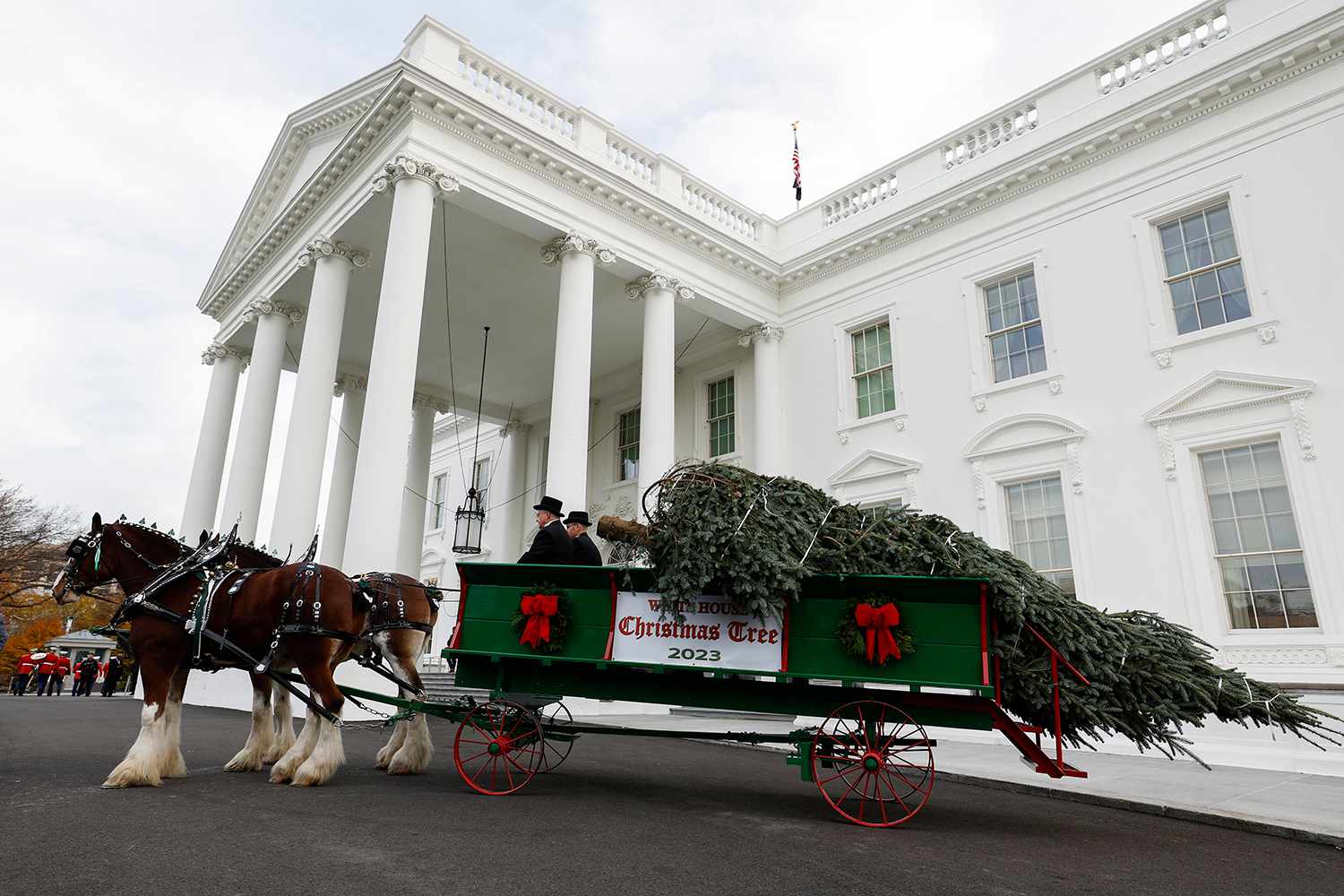 First lady Jill Biden welcomes the official 2023 White House Christmas Tree at the White House on November 20, 2023 in Washington, DC. Biden was joined by military-connected families to receive the 18 and a half foot Fraser Fir from Fleetwood, North Carolina.