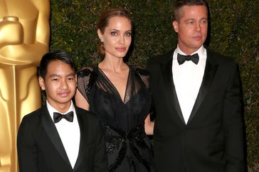 Maddox Jolie-Pitt, Angelina Jolie, and Brad Pitt arrive at the Academy of Motion Picture Arts and Sciences' Governors Awards on November 16, 2013 in Hollywood, California. 
