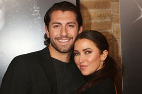 Jason Tartick and Kaitlyn Bristowe pose at the 25th Anniversary of "Chicago" on Broadway at The Ambassador Theater on November 16, 2021 in New York City.