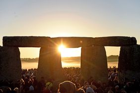 Visitors celebrate summer solstice and the dawn of the longest day of the year at Stonehenge in Amesbury, England. 