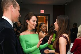 BOSTON, MASSACHUSETTS - DECEMBER 02: Prince William, Prince of Wales, Catherine, Princess of Wales and Ellie Goulding speak backstage after The Earthshot Prize 2022 at MGM Music Hall at Fenway on December 02, 2022 in Boston, Massachusetts. The Prince and Princess of Wales are visiting the coastal city of Boston to attend the second annual Earthshot Prize Awards Ceremony, an event which celebrates those whose work is helping to repair the planet. During their trip, which will last for three days, the royal couple will learn about the environmental challenges Boston faces as well as meeting those who are combating the effects of climate change in the area. (Photo by Samir Hussein/WireImage)