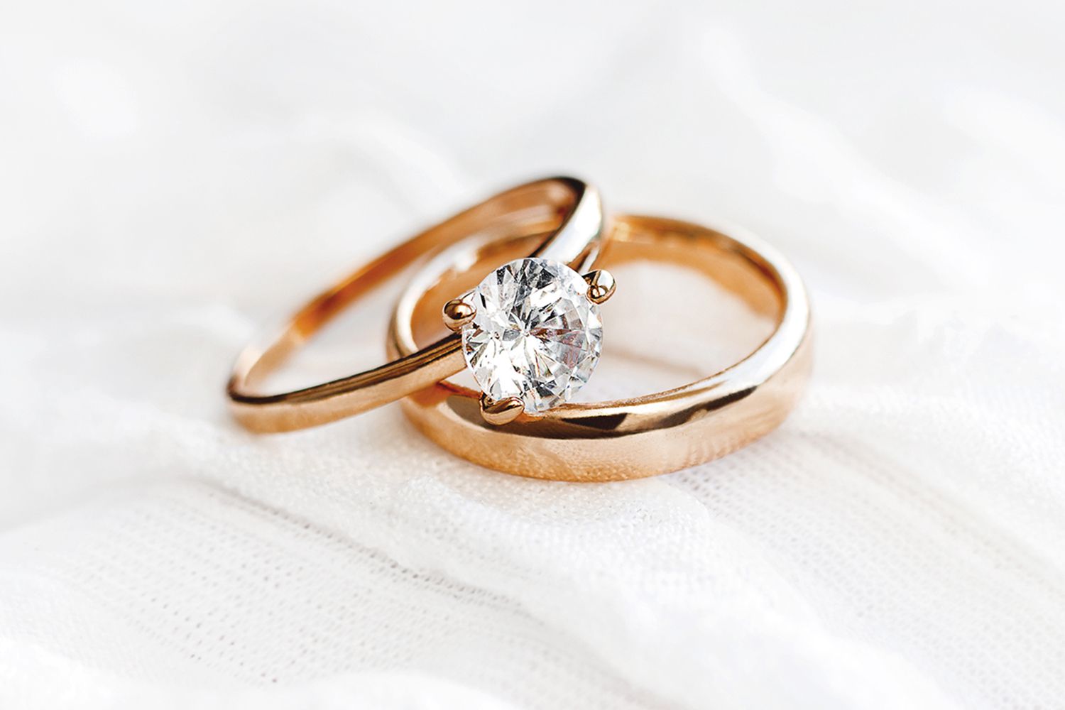 Stock image of diamond engagement ring and wedding band.