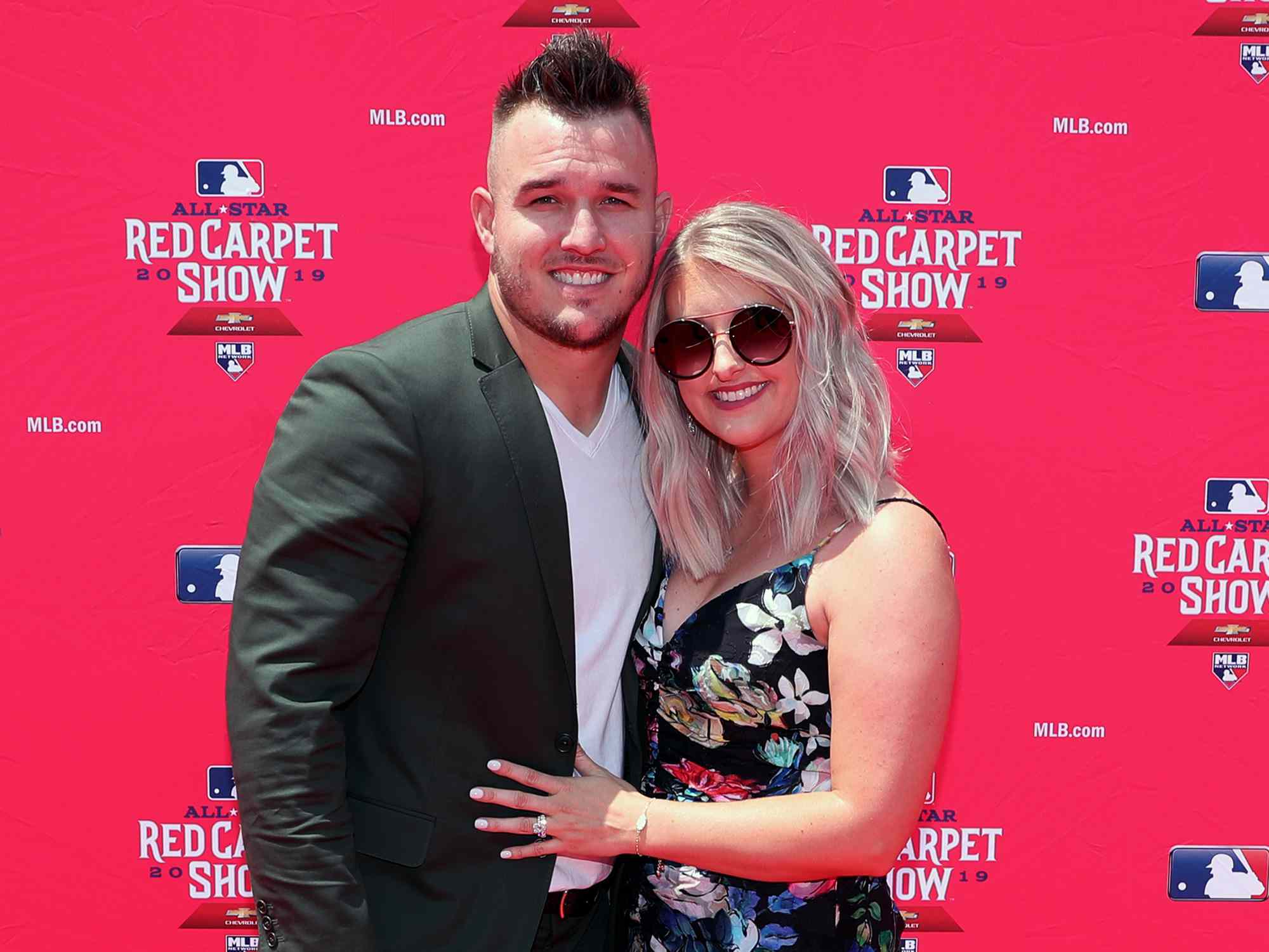 Mike Trout #27 of the Los Angeles Angels poses for a photo with his wife Jessica Cox during the MLB Red Carpet Show