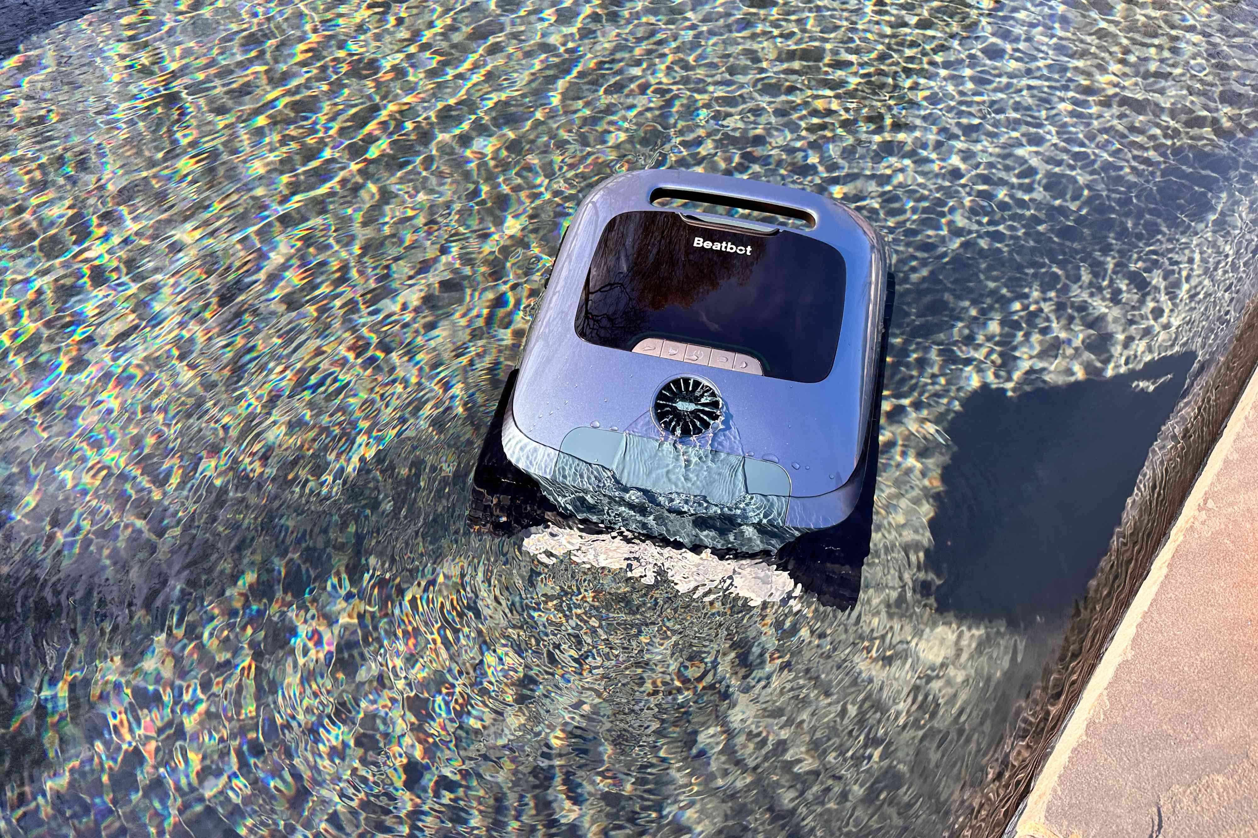 The Beatbot AquaSense Pro Pool Cleaner in a pool while cleaning the water