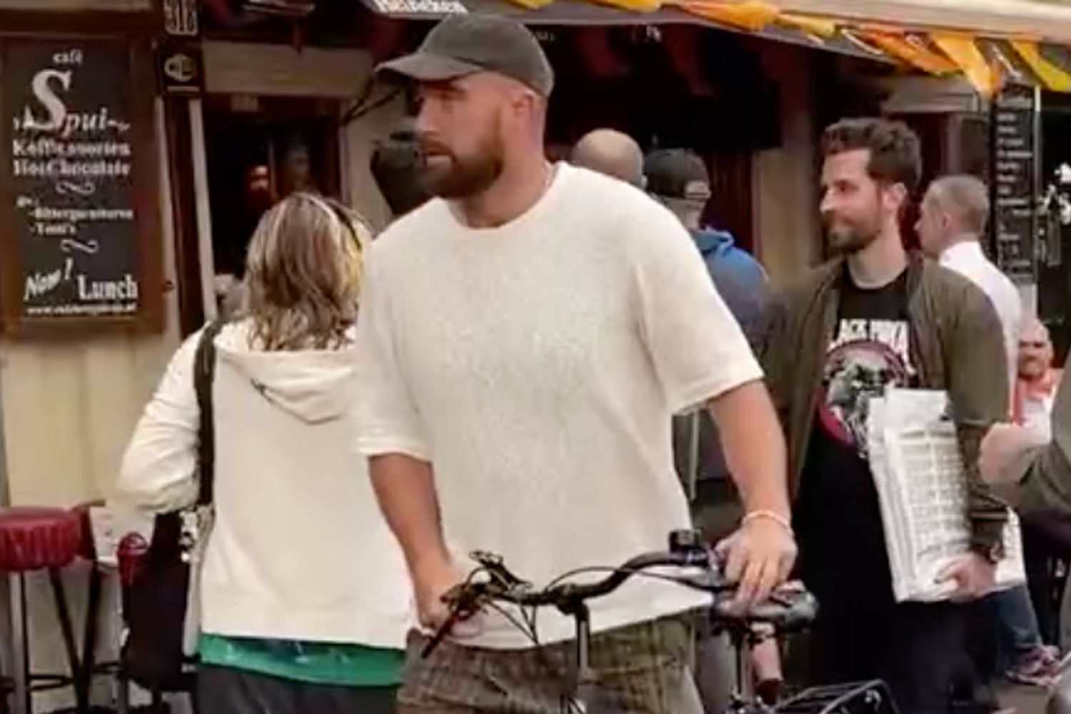 Travis Kelce Riding a bike in Amsteram