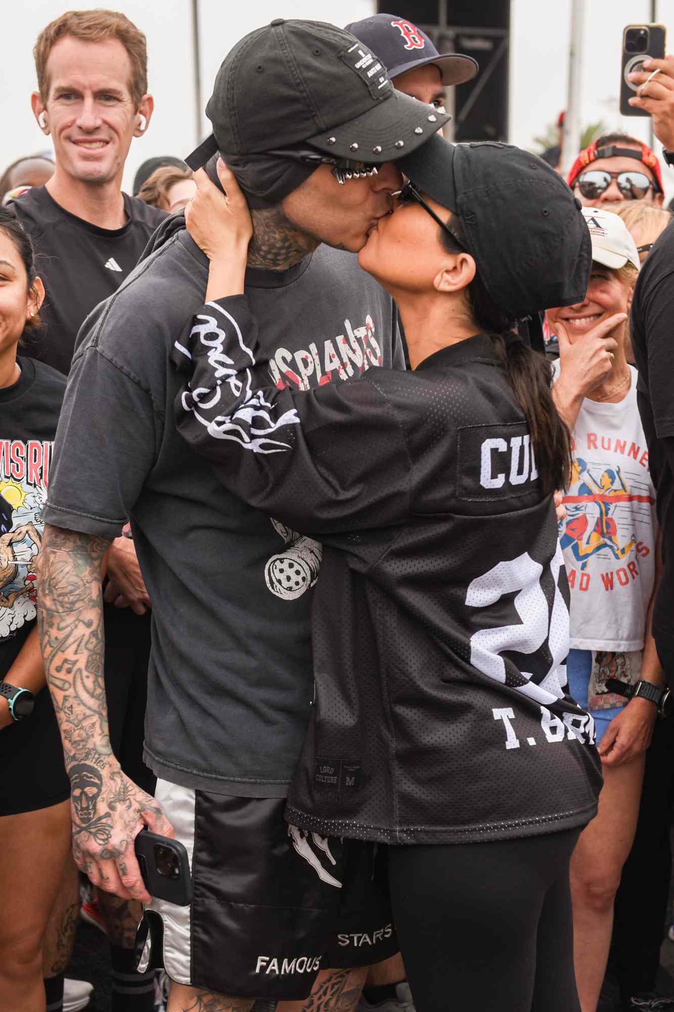 Travis Barker and Kourtney Kardashian attend Travis Barker's Run Travis Run: A Run & Wellness Experience at The Kia Forum on July 06, 2024 in Inglewood, California. 