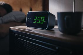 Man Wakes Up and Turns off Alarm Clock