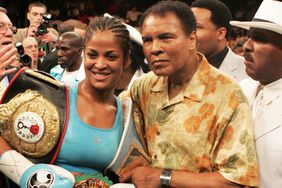 Laila Ali poses with her father, Muhammad Ali after her 10 round WBC/WIBA Super Middleweight title bout with Erin Toughill. 