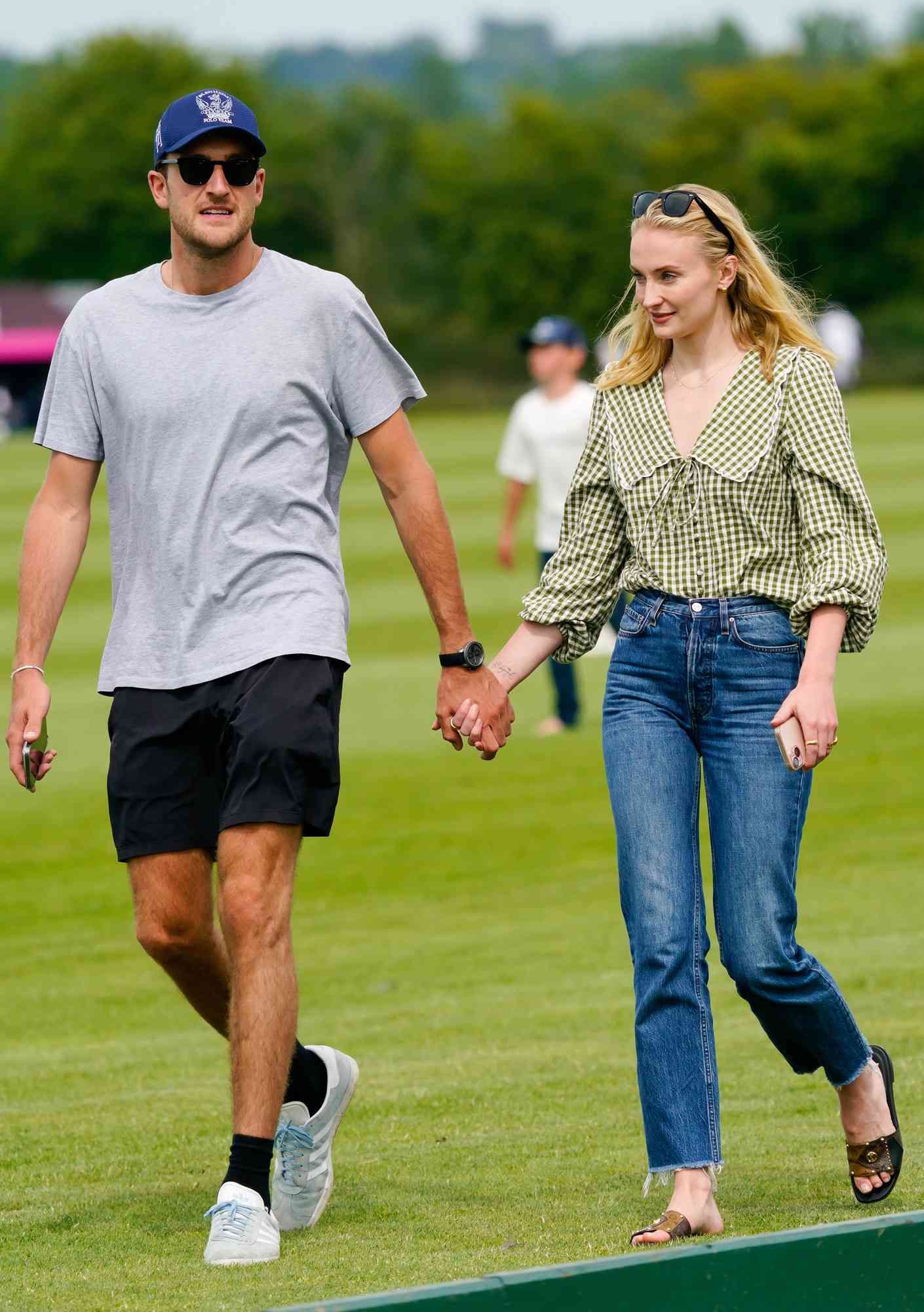Actress Sophie Turner enjoys a relaxed family day with boyfriend Peregrine Pearson at a polo match on his family's West Sussex estate on June 29, 2024. 