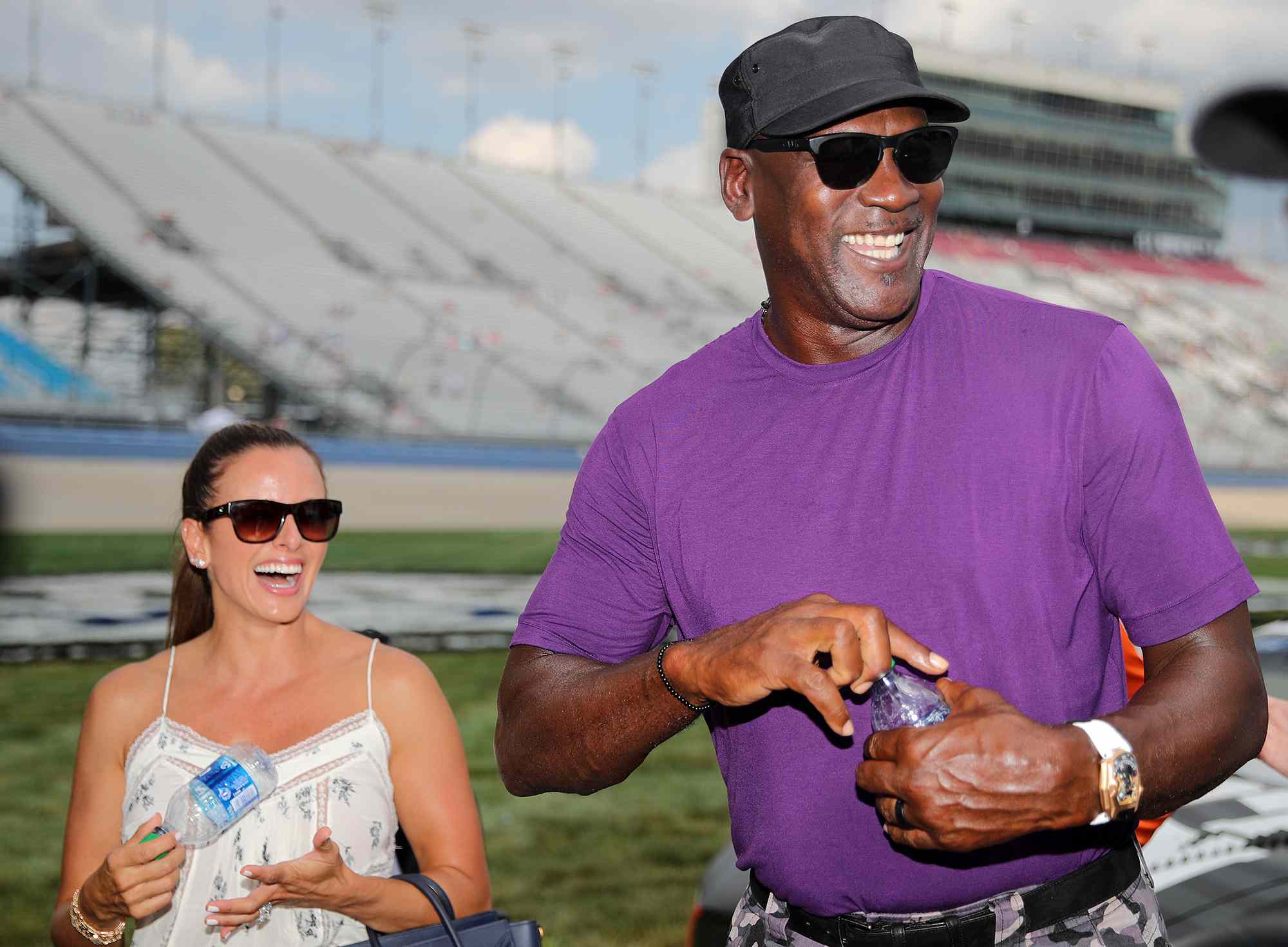 Michael Jordan walks the grid with his wife, Yvette Prieto during qualifying for the NASCAR Cup Series Ally 400 at Nashville Superspeedway on June 25, 2022 in Lebanon, Tennessee