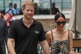 Prince Harry Duke of Sussex, and Britain's Meghan Markle, Duchess of Sussex, arrive for an exhibition sitting volleyball match at Nigeria Unconquered, a local charity organisation that supports wounded, injured, or sick servicemembers, in Abuja on May 11, 2024 as they visit Nigeria as part of celebrations of Invictus Games anniversary.