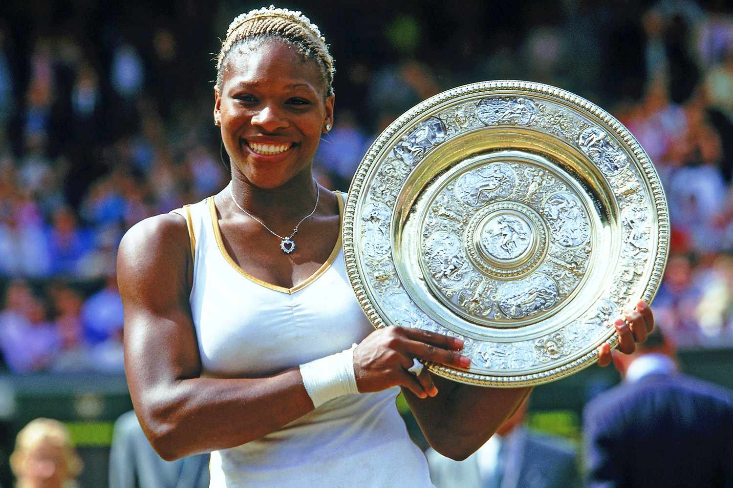 WIMBLEDON - JULY 6: Wimbledon Ladies champion Serena Williams of the USA poses with the winning trophy at the Wimbledon Lawn Tennis Championship held at the All England Lawn Tennis and Croquet Club in Wimbledon, London on July 6, 2002. (Photo by Mike Hewitt/Getty Images)