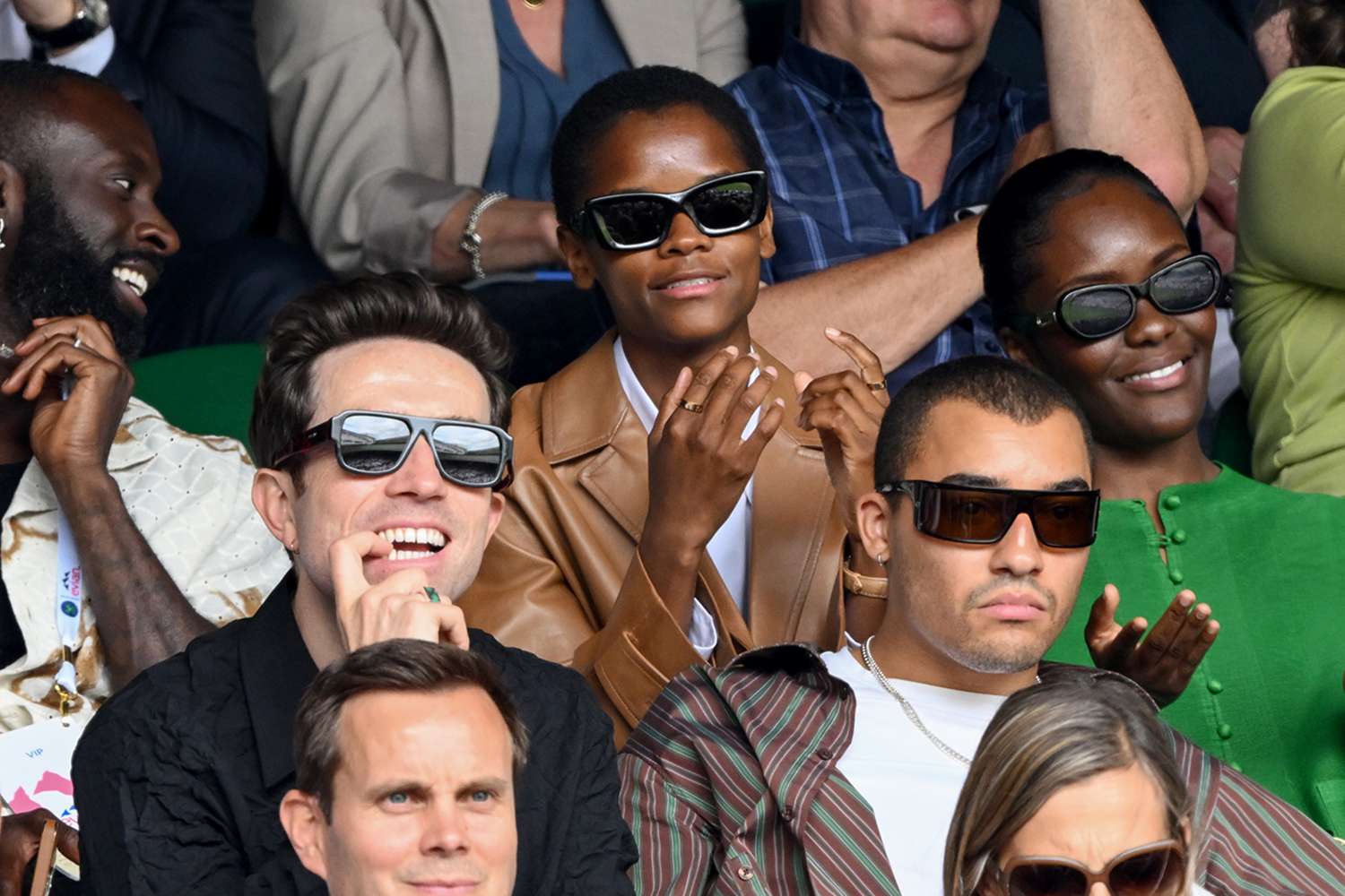 Nick Grimshaw (L), Letitia Wright (C) and Meshach Henry attend day nine of the Wimbledon Tennis Championships at the All England Lawn Tennis and Croquet Club on July 11, 2023 in London, England. 