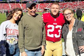 Olivia Culpo poses with her parents at a football game