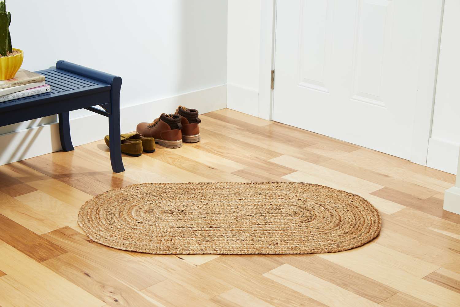 The nuLOOM Rigo Hand Woven Jute Area Rug on a wooden floor