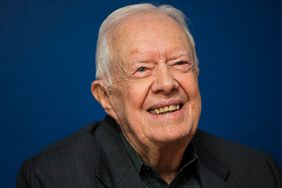 Former U.S. President Jimmy Carter smiles during a book signing event for his new book 'Faith: A Journey For All' at Barnes & Noble bookstore in Midtown Manhattan, March 26, 2018