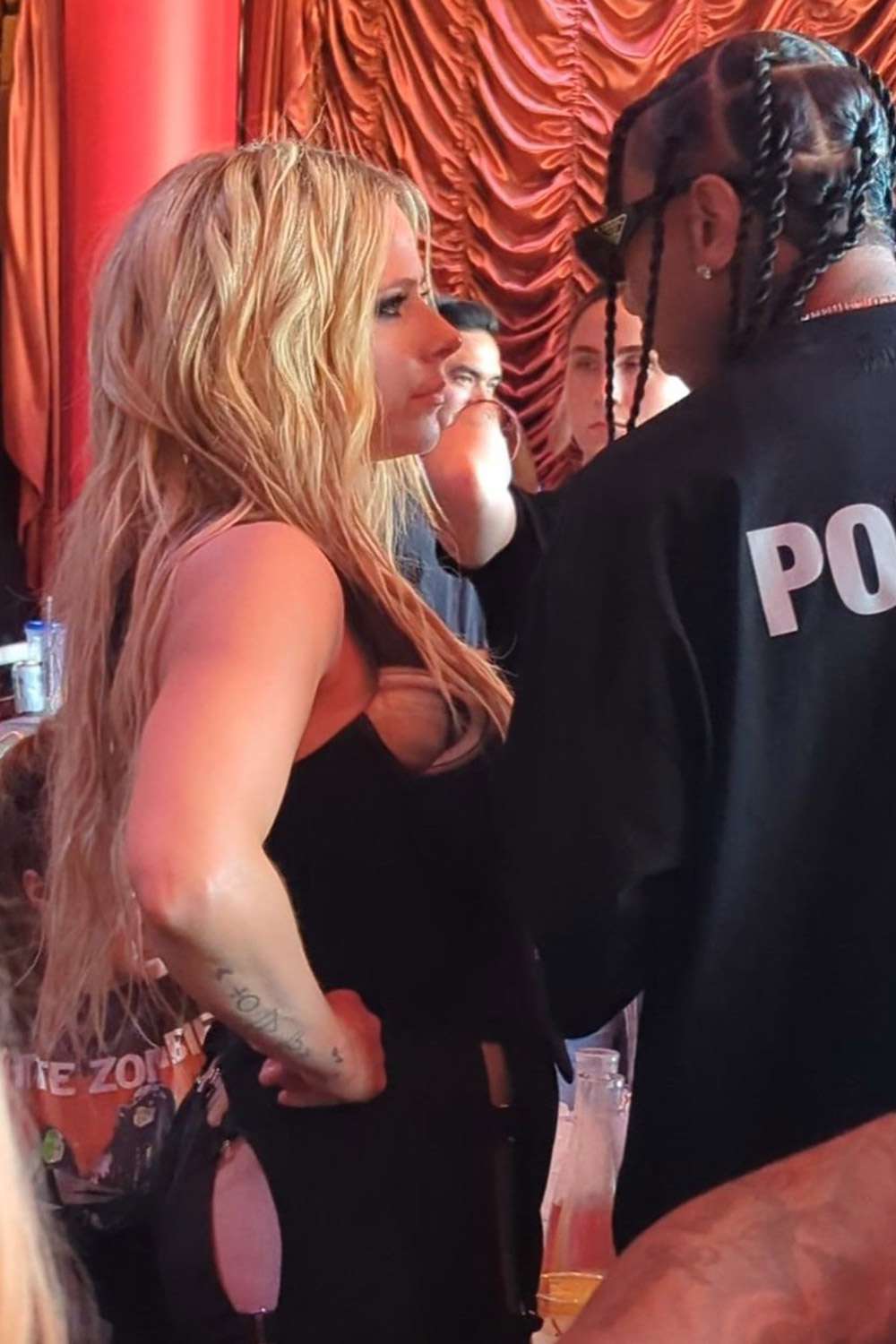 Avril Lavigne and Tyga were spotted getting close at a VIP table during Marshmelo's 4th of July weekend DJ set at the Encore Beach Club